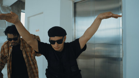 Closeup portrait of multicultural hipster dancing while looking at camera. Attractive break dancer...
