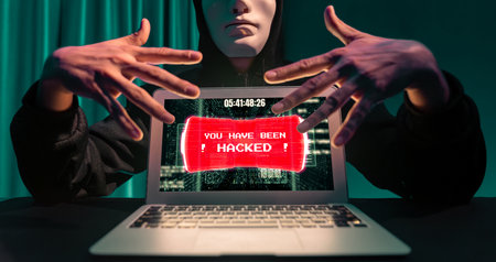 Criminal anonymous mask successful making password encryption by programming hack on laptop of insecure thorough privacy taking massive database of charge service unlock or cheat condition. Pecuniary.の写真素材