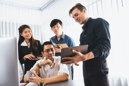 Group of diverse office worker employee working together on strategic business marketing planning in corporate office room. Positive teamwork in business workplace concept. Prudentの写真素材