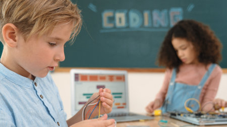 Girl standing while fixing electronic board by using screwdriver. American student and happy...