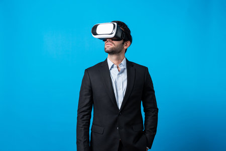 Skilled project manager with VR glasses standing and looking around. Caucasian businessman...