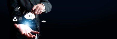 Business person implements initiatives to reduce CO2 emissions, aiming for net zero. Showcases commitment to sustainability by reducing CO2 for a greener planet. FaaSの写真素材