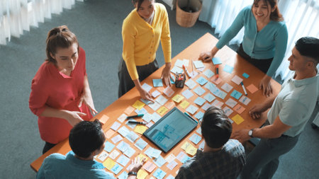Top down view of smart business people shaking hands and making a contract. Aerial view of architect...