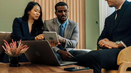 Ornamented office overlooking city skyline, diversity corporate professional discuss ambitious business expansion or strategic marketing. Financial advisor give consulting business insights and ideaの写真素材