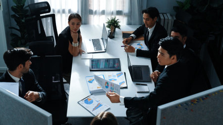 Top view of diverse business people brainstorm marketing idea while marketing team analyst stock market investment. Group of skilled project manager solving problems and sharing plan. Directorate.の写真素材