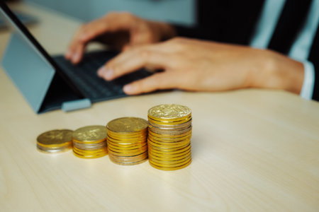 Businessman working with coin money currency. Concept of investment growth and money saving. udsの写真素材