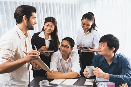 Group of diverse office worker employee working together on strategic business marketing planning in corporate office room. Positive teamwork in business workplace concept. Prudentの写真素材