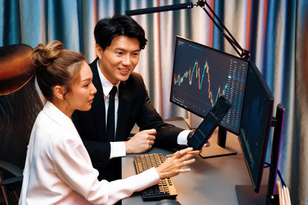 Businessman holding tablet on dynamic stock exchange statistic online showing to partners to share,...