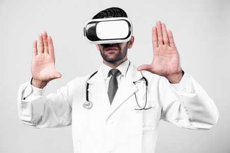Professional doctor wearing VR glasses and lab coat while holding medical form. Attractive doctor looking at form while using metaverse or virtual reality world to talk and cure patient. Deviation.の写真素材