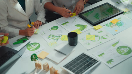 Close up of team hand brainstorming and planning about environmental investment. Project manager...
