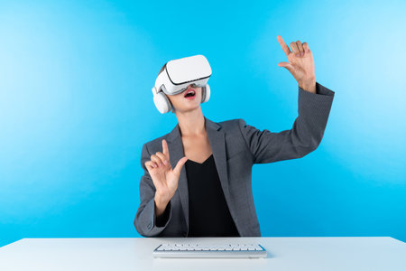 Professional business woman comparing data analysis while using VR goggles. Caucasian manager looking at financial data while connecting with metaverse by using visual reality headset. Contraption.の写真素材