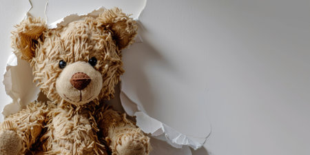 Close up view picture of the hollow white hole on the the wall that show the teddy stay inside the wall that has been made from some material yet still can be break to look through other side. AIGX03.の素材
