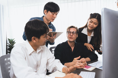 Group of diverse office worker employee working together on strategic business marketing planning in corporate office room. Positive teamwork in business workplace concept. Prudentの写真素材