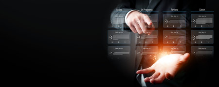 Business person organizes tasks and things to do into categories, streamlining review project...