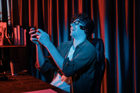 Young gaming streamer team getting winner players with Esport online on smartphone fighting wearing...