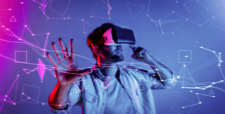 Smart man looking data or connecting with big data or virtual reality by using goggle or VR headset. Caucasian person exploring metaverse world and touching simulated program. Technology. Deviation.の写真素材