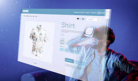 Caucasian man choosing and selecting product for shopping list while wearing visual reality goggles. Skilled person sitting at sofa with shopping bags while using VR glasses. Technology. Deviation.の写真素材