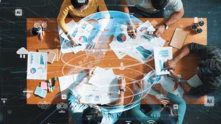 Top down view of civil engineers planning and writing at blueprint. Architect team working together to design building construction with global networking communication or big data base. Symposium.の写真素材