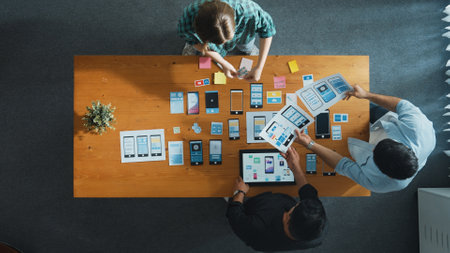 Top view of smart Ui designer brainstorming and planning about Ux Uo design or mobile interface...