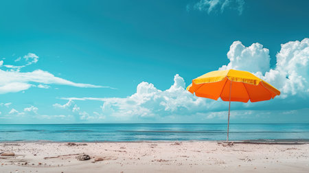 A vibrant beach umbrella provides shade on the sandy shore overlooking the sparkling ocean, with people enjoying the coastal natural landscape under a clear sky AIG50の素材