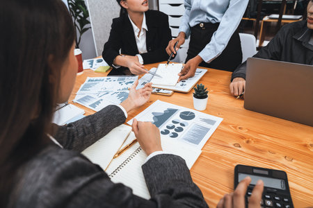 Multiracial analyst team use BI dashboard data to analyze financial report on meeting table. Group of diverse business people utilize data analysis by FIntech for business marketing decision. Concordの写真素材