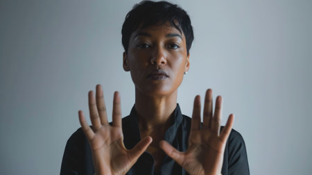 The picture of the interpreter is using the hand signal with the grey background as the wallpaper, the interpreter require skill like cultural awareness and proficiency in multiple languages. AIG43.の素材