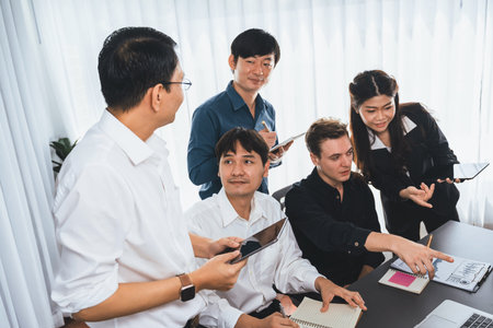 Group of diverse office worker employee working together on strategic business marketing planning in corporate office room. Positive teamwork in business workplace concept. Prudentの写真素材