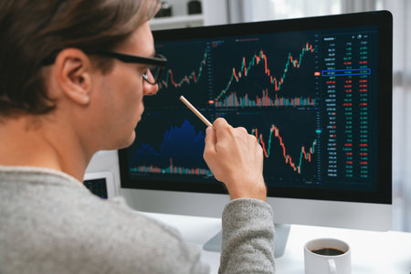 Smart stock investors pointing interesting market stock exchange on pc with laptop screen. Financial...