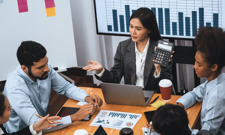 Top view multiracial analyst team use BI dashboard data to analyze financial report on meeting...