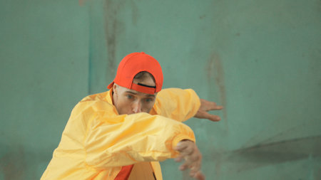 Closeup image of caucasian hipster shows or practicing footstep at street, urban city. Motion shot...