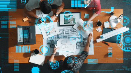 Top down view of engineer planning and writing at blueprint. Architect team working together to...