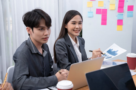 Businessman presenting data analysis dashboard display on TV screen in modern meeting for marketing strategy. Business presentation with group of business people in conference room. Concordの写真素材