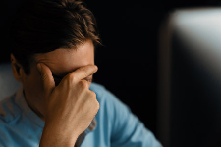Thinking of stressful financial analyst researching on business paragraph on pc screen with dynamic...