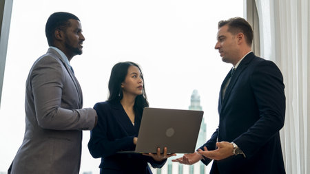 Ornamented office overlooking city skyline, diversity corporate professional discuss ambitious business expansion or strategic marketing. Financial advisor give consulting business insights and ideaの写真素材