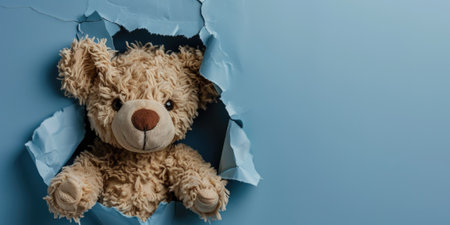 Close up view picture of the hollow blue hole on the the wall that show the teddy stay inside the wall that has been made from some material yet still can be break to look through other side. AIGX03.の素材