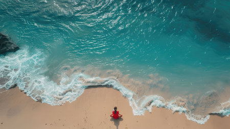 An aerial view of two individuals standing on the beach, overlooking the azure waters with surfboards in hand AIG50の素材
