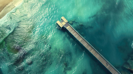 An aerial view of a tropical island showcasing a dock extending into the aqua water leading to a beautiful beach surrounded by lush green trees and natural landscape AIG50の素材