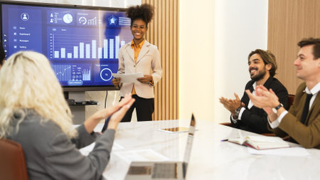 Diverse group of office worker and employee applauding, happy collaborate on strategic business marketing planning. Teamwork and positive attitude create productive and supportive in ornamented officeの写真素材