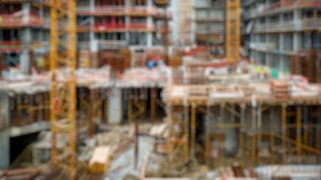 Blur background of new residential house under construction in a suburban area. Real estate development and home building concept. Design for real estate posters, banners. Construction site. Spate.の写真素材