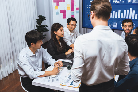 Analyst team utilizing BI Fintech to analyze financial data at table in meeting room. Businesspeople analyzing BI dashboard power for business insight and strategic marketing planning. Prudentの写真素材