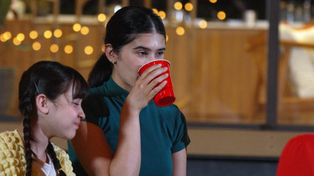 Family gather for holiday celebration. All family member drink beverage in glass to celebrate. Outdoor camping activity relax with food and spend time with relatives cross generation gap. Divergence.の写真素材