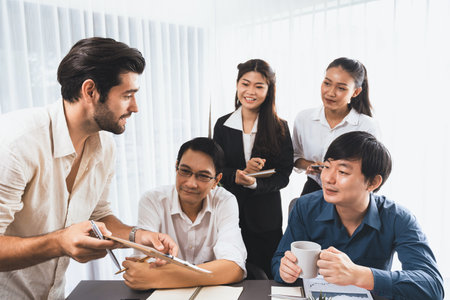Group of diverse office worker employee working together on strategic business marketing planning in corporate office room. Positive teamwork in business workplace concept. Prudentの写真素材