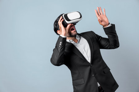 Close up of smart project manager looking financial graph hologram from VR glass. Professional...