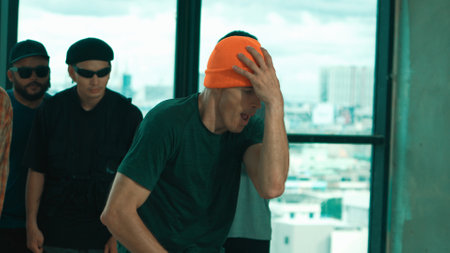 Group of multicultural hipster practice break dance with cityscape or sky scrapper view. Attractive people dancing together while moving body to music. Outdoor sport 2024. Blue filter. Endeavor.の写真素材