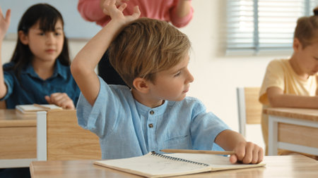 Caucasian boy looking at blackboard while diverse skilled student learning at school and taking a...