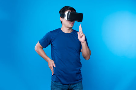 Smart gamer wearing VR turning to metaverse world playing gun shooting hunter isolated blue...