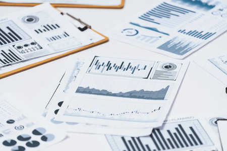 Piles of business intelligence paper or BI financial report and financial data visualization on paperwork for business analytic marketing and strategic planning at office desk. Prudentの写真素材