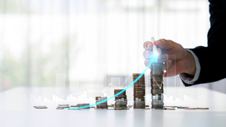 Coin stack with digital graphic indicator symbolizing business investment and economic growth. Businessman doing financial planning to achieve financial goal and contribute to profit. Shrewdの写真素材