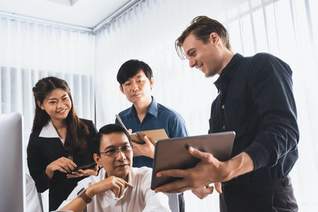 Group of diverse office worker employee working together on strategic business marketing planning in corporate office room. Positive teamwork in business workplace concept. Prudentの写真素材