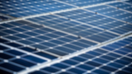 Blur background of solar station panel in the field with blue sky. Clean electrical energy. Ecology....